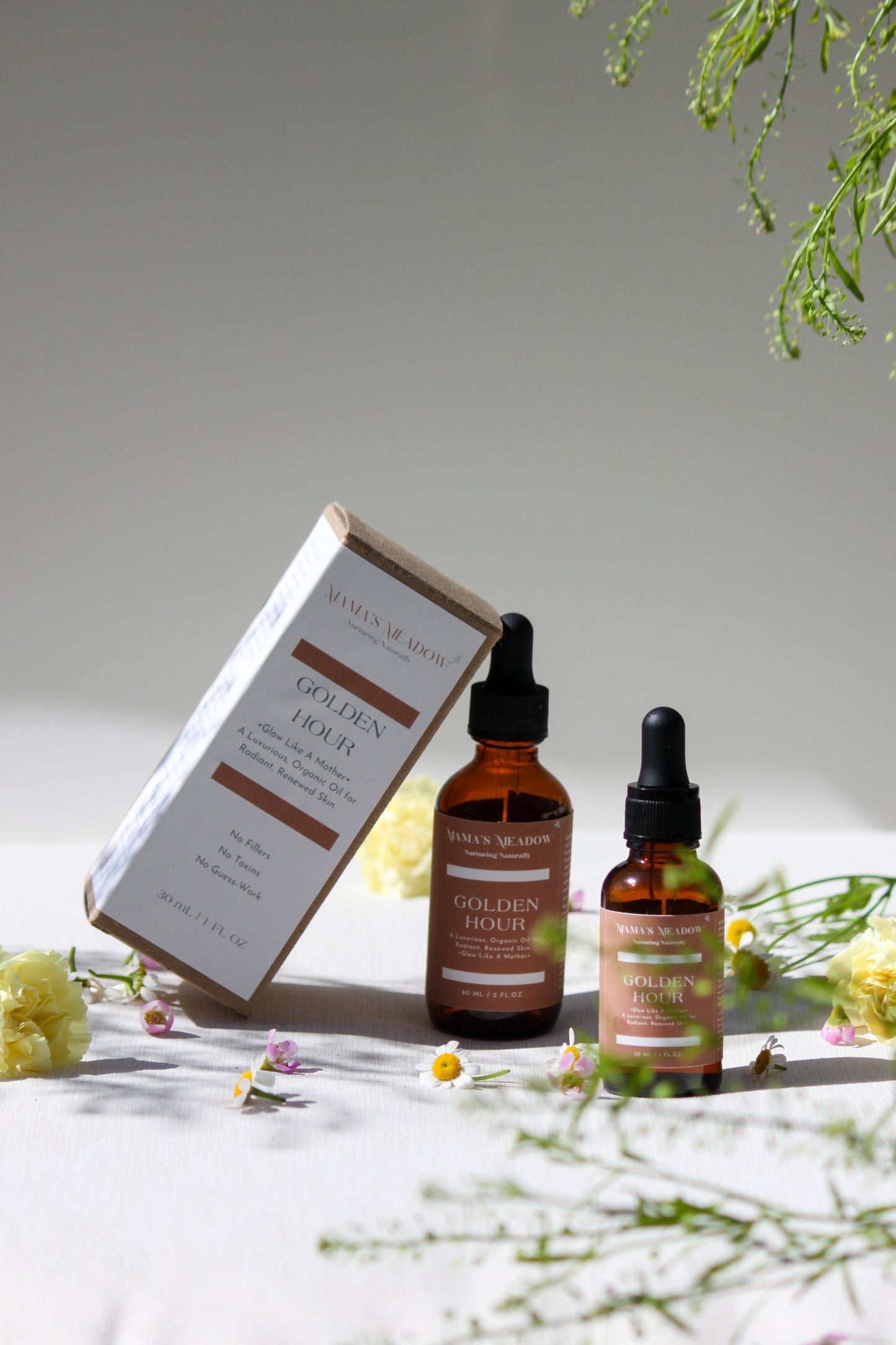 A luxurious evening facial oil in a glass dropper bottle, made with black seed oil, rosehip oil, and frankincense essential oil to nourish, restore radiance, and reduce fine lines for busy mothers.