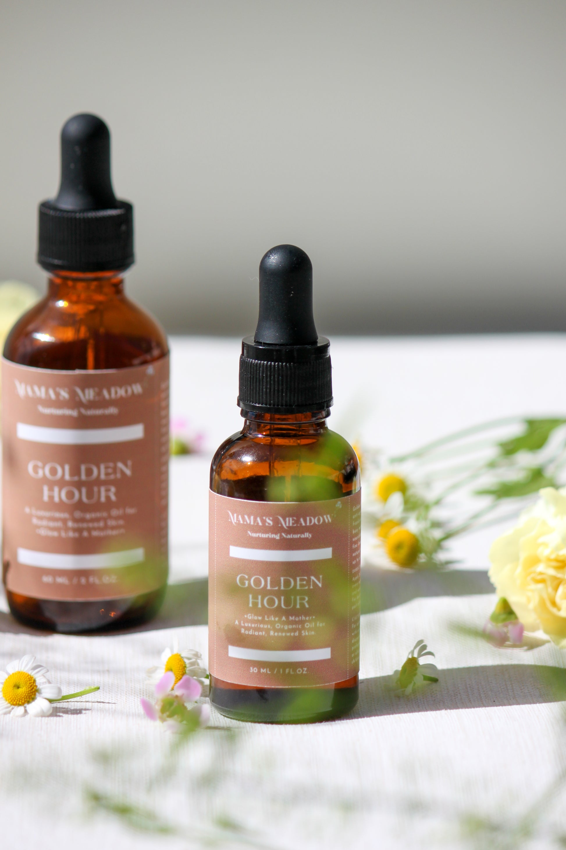 A luxurious evening facial oil in a glass dropper bottle, made with black seed oil, rosehip oil, and frankincense essential oil to nourish, restore radiance, and reduce fine lines for busy mothers.