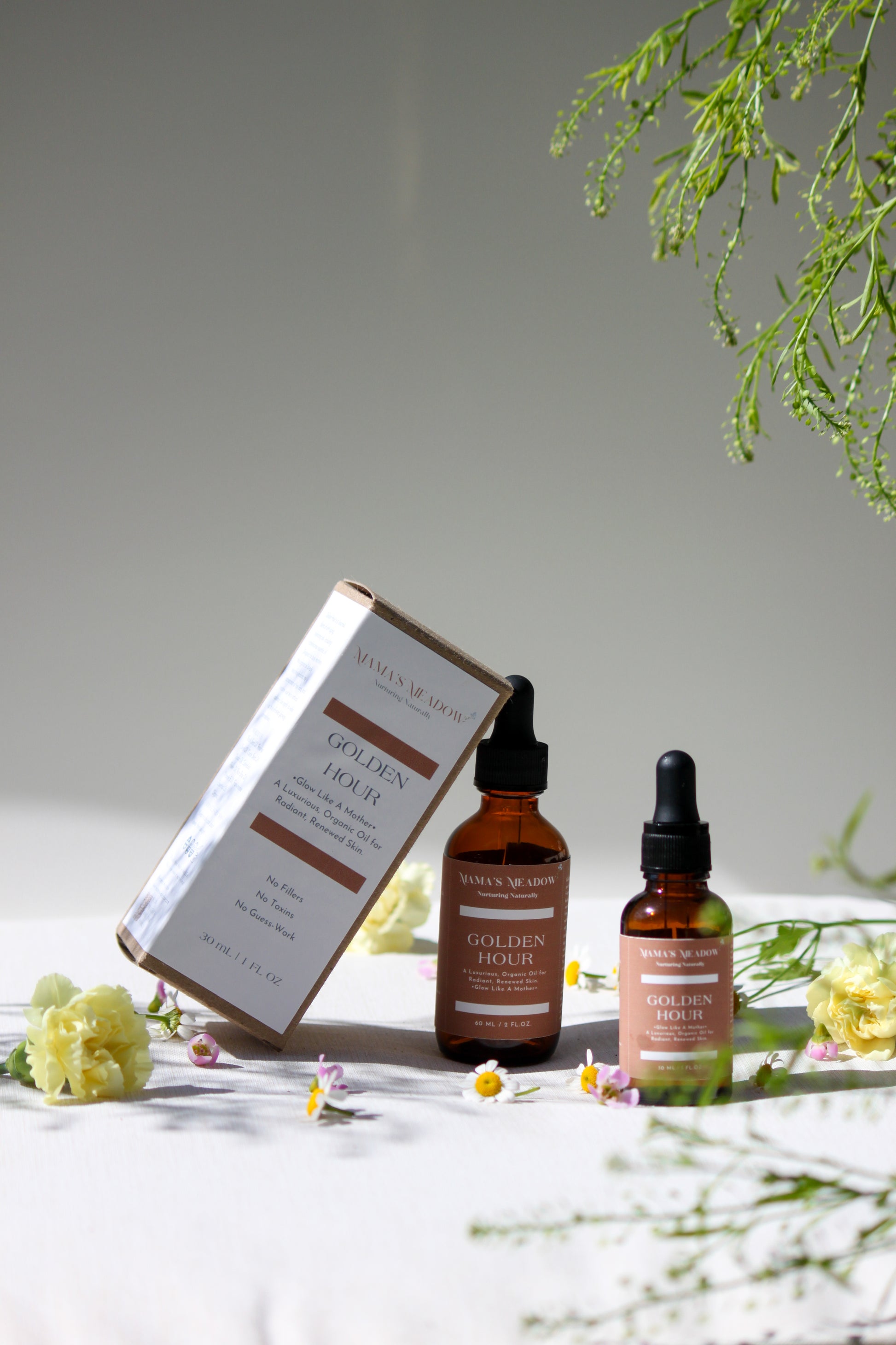 A luxurious evening facial oil in a glass dropper bottle, made with black seed oil, rosehip oil, and frankincense essential oil to nourish, restore radiance, and reduce fine lines for busy mothers.