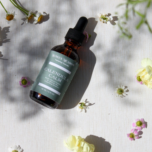 A gentle, all-purpose skin oil in a glass bottle, infused with coconut oil, jojoba oil, and calendula oil to hydrate and soothe sensitive skin, perfect for the whole family.