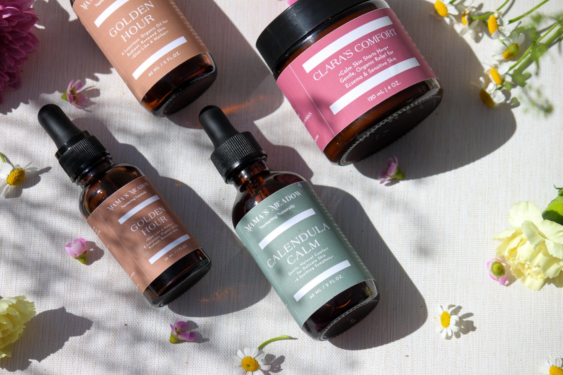 Skincare products including bottles and jars on a light background with flowers.