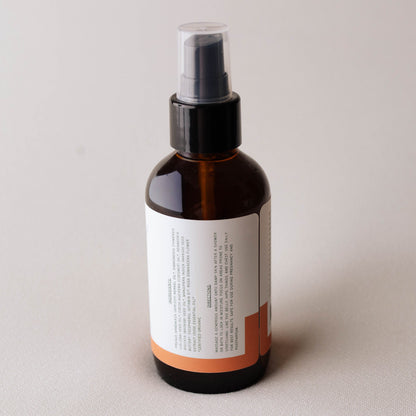 Brown Mama's Meadow spray bottle with a label on a light gray background
