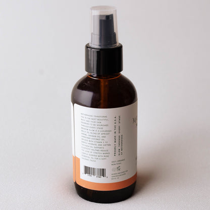 Brown  Mama's Meadow spray bottle with a label on a light gray background